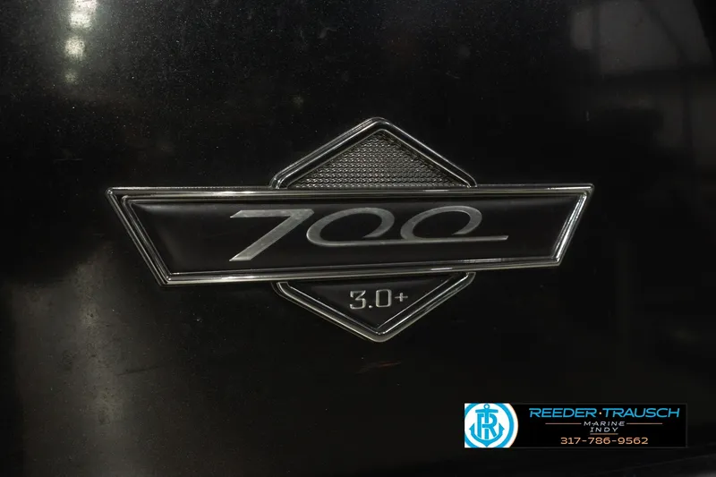 Slide: The Image of Emblem of 2017 South Bay 725 RS with "700 3.0+" badge on black surface. - 56