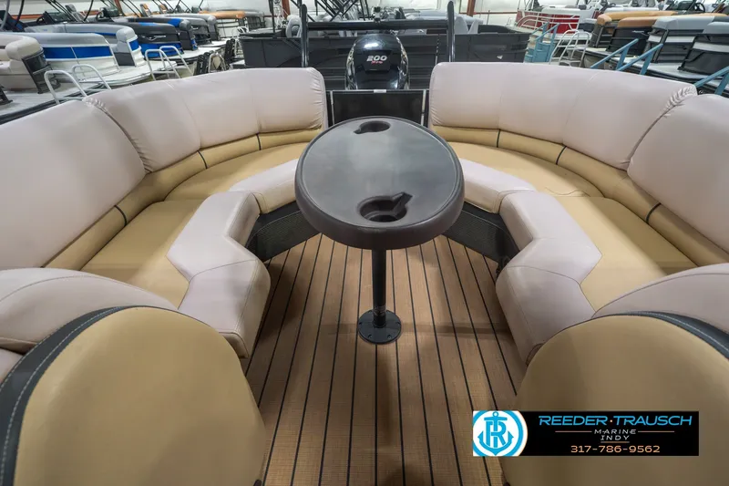 Slide: The Image of 2017 South Bay 725 RS pontoon boat interior with plush seating and table. - 32