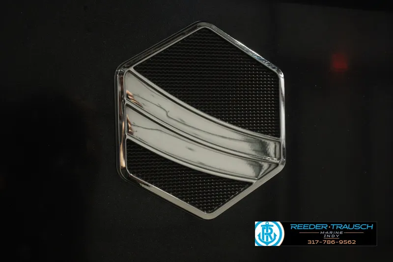 Slide: The Image of Chrome emblem on 2017 South Bay 725 RS boat, featuring Reeder Trausch Marine logo. - 55