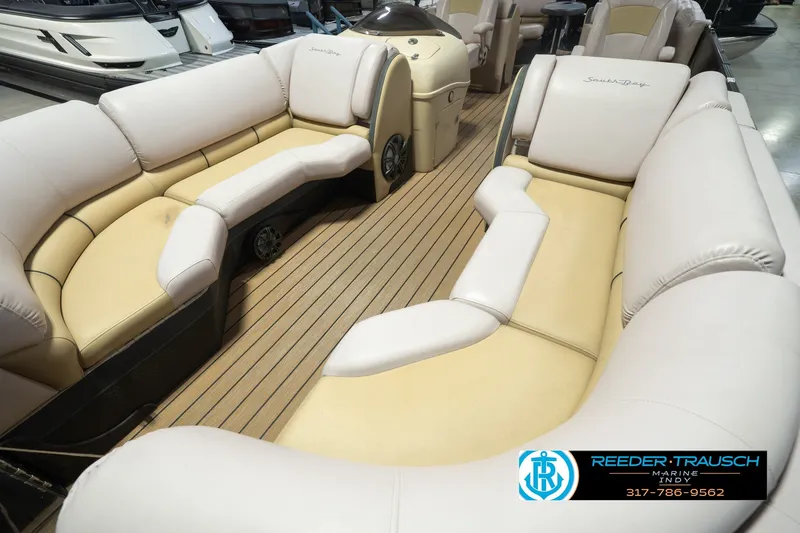 Slide: The Image of Luxurious interior of a 2017 South Bay 725 RS pontoon boat with plush seating. - 13