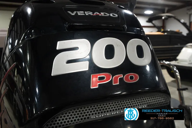 Slide: The Image of Close-up of a 2017 South Bay 725 RS boat engine, featuring "200 Pro" branding. - 53