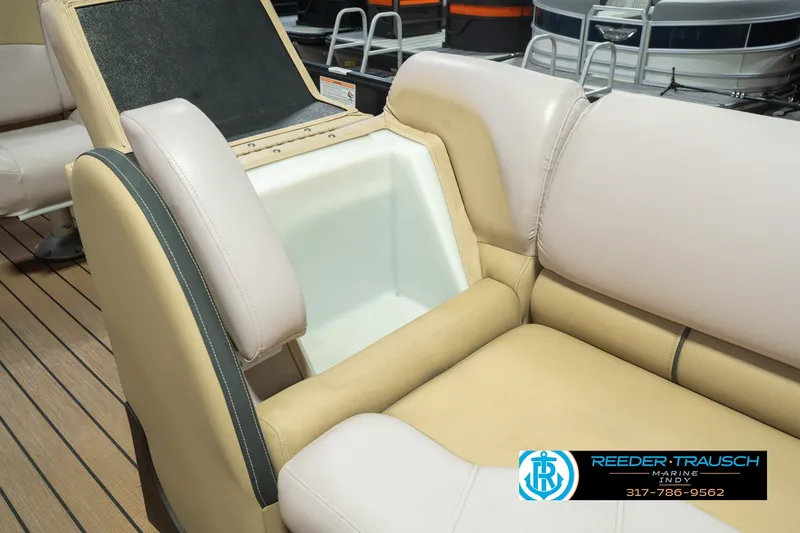 Slide: The Image of 2017 South Bay 725 RS boat interior with beige seating and storage compartment. - 30