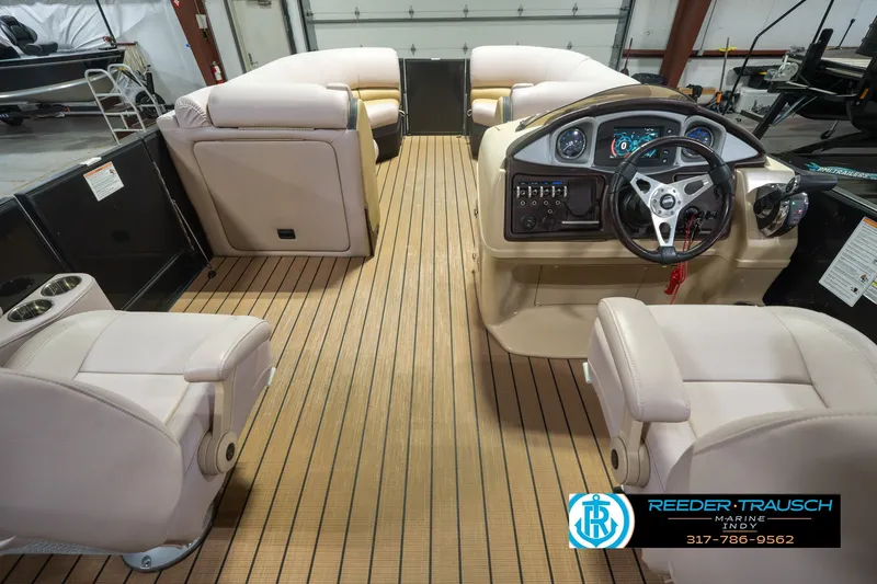 Slide: The Image of 2017 South Bay 725 RS boat interior with beige seating and modern dashboard. - 24