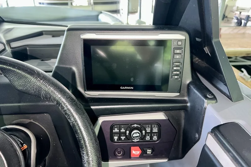 Slide: The Image of Dashboard of 2023 Axis A225 boat featuring Garmin display and control panel. - 18