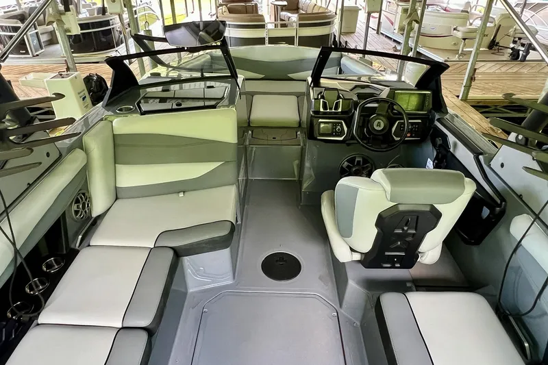 Slide: The Image of 2023 Axis A225 boat interior with modern seating and advanced dashboard controls. - 14