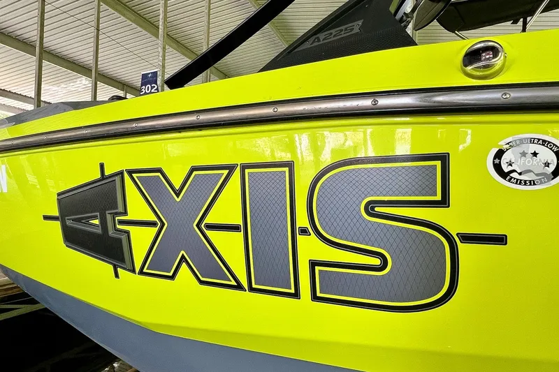 Slide: The Image of 2023 Axis A225 boat with bold logo and ultra-low emission sticker. - 33