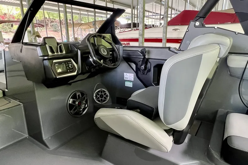 Slide: The Image of 2023 Axis A225 boat interior with modern dashboard and comfortable seating. - 15