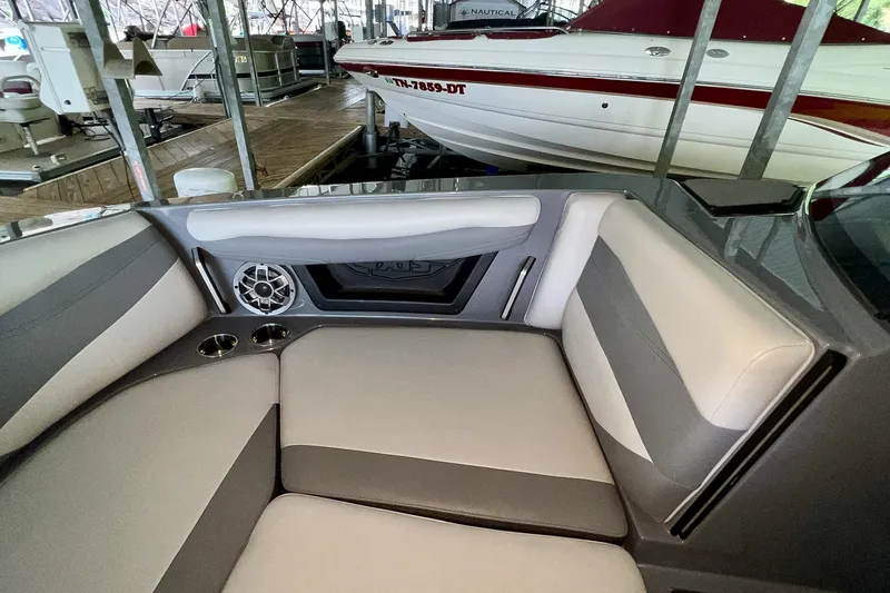 Slide: The Image of Interior of 2023 Axis A225 boat with cushioned seating and speaker system. - 24