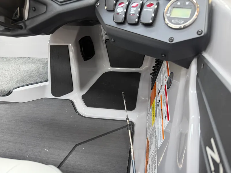 Slide: The Image of The image shows the cockpit of a Skeeter ZXE20 boat with modern controls and instruments. - 14