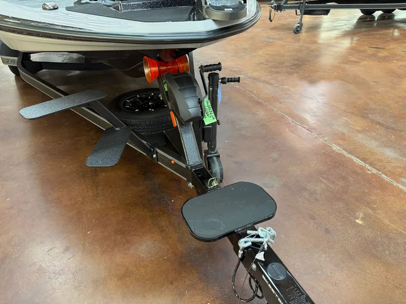 Slide: The Image of A Skeeter ZXE20 boat on a trailer with non-slip steps and a spare tire. - 22