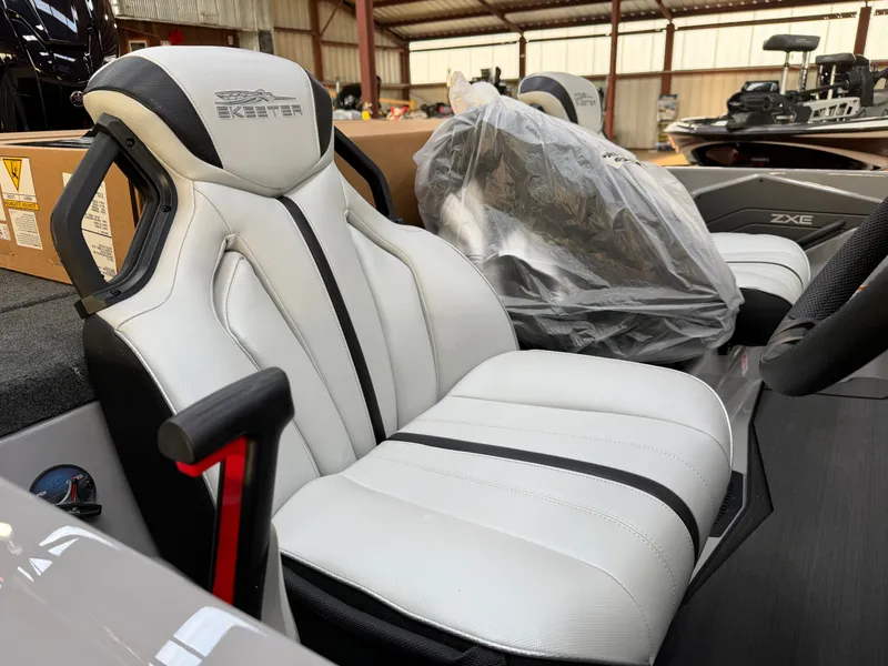 Slide: The Image of The image shows the interior of a 2027 Skeeter ZXE20 with white leather seats. - 15