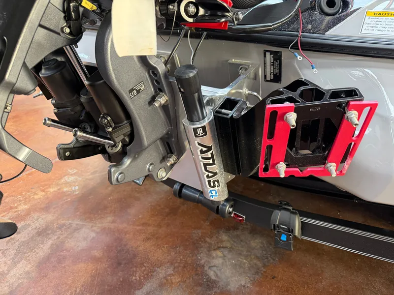 Slide: The Image of Close-up of a boat's stern with an Atlas hydraulic jack plate and motor mount. - 19