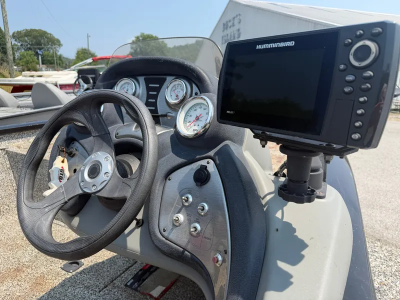 Slide: The Image of The image shows the helm of a 2015 Tracker Pro Team 175 TXW boat with a Humminbird fish finder. - 6