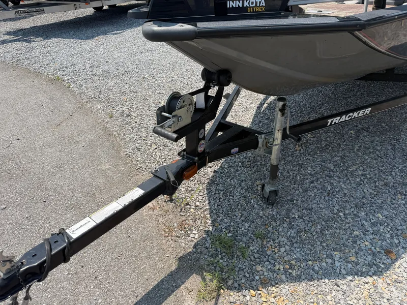 Slide: The Image of A 2015 Tracker Pro Team 175 TXW on a trailer, parked on a gravel lot. - 16