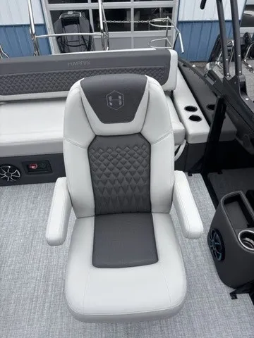 Slide: The Image of A luxurious padded boat seat with armrests and quilted pattern on a Harris SUNLINER 230 SLDH. - 10