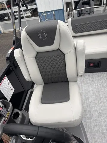 Slide: The Image of A luxurious padded seat with armrests and quilted pattern on a boat. - 11