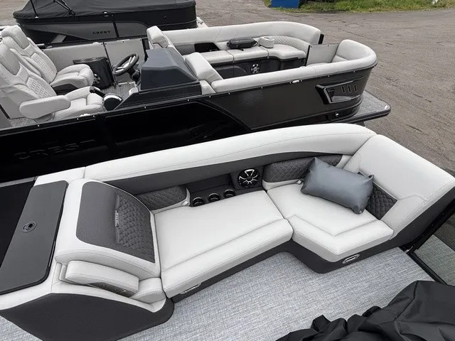 Slide: The Image of A luxurious pontoon boat with sleek, upholstered seating and a modern design. - 7