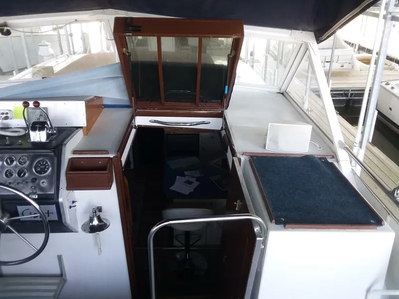 Slide: The Image of The image shows the cockpit of a 1979 Chris-Craft 350 Catalina with helm and cabin access. - 18