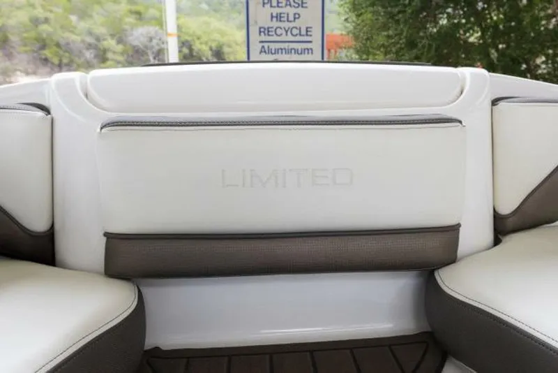 Slide: The Image of The image shows the rear seat of a boat with white and brown upholstery. - 32