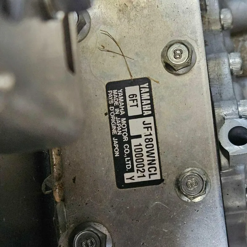 Slide: The Image of Close-up of a Yamaha engine part with serial number and manufacturer details. - 16