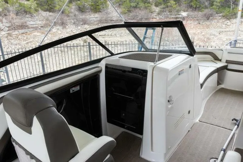 Slide: The Image of The image shows the cockpit of a 2016 Yamaha 242 Limited S E-Series boat with modern seating and controls. - 43