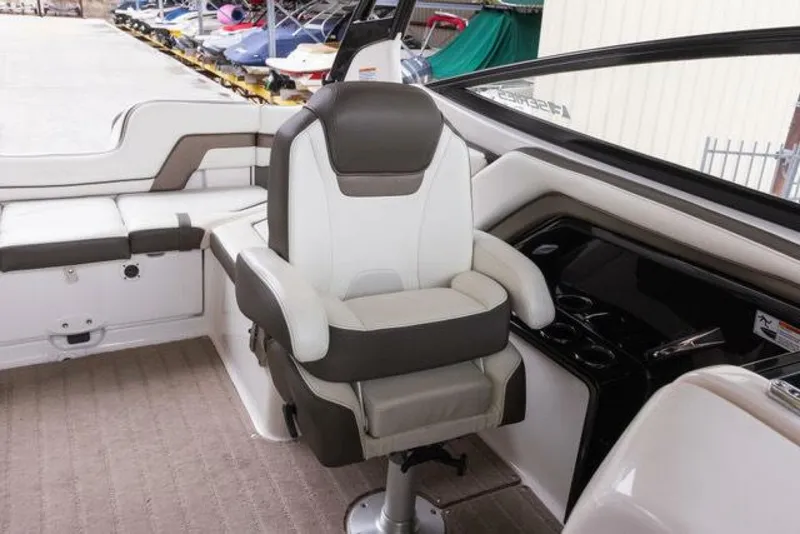 Slide: The Image of The interior of a 2016 Yamaha 242 Limited S E-Series boat with a swivel captain's chair. - 42
