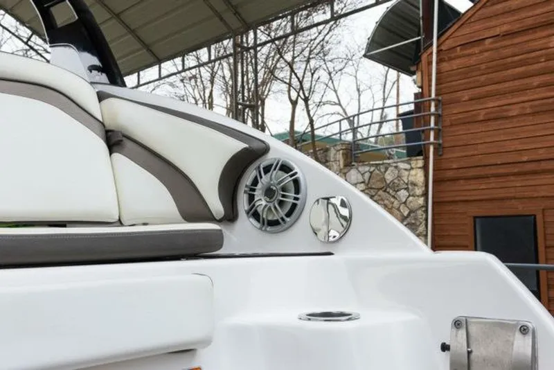 Slide: The Image of Close-up of a speaker and cup holder on a Yamaha 242 Limited S E-Series boat. - 47