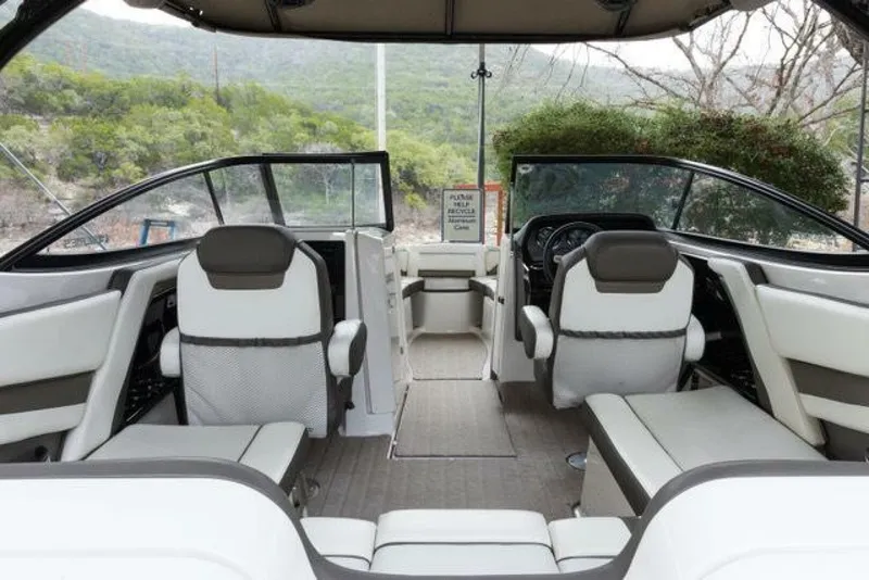 Slide: The Image of Interior view of a 2016 Yamaha 242 Limited S E-Series boat with white and gray seating. - 45