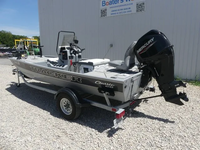 Slide: The Image of A 2026 Tracker Bass Tracker Classic CC on a trailer, featuring a Mercury outboard motor. - 4