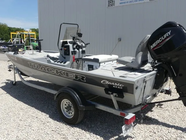 Slide: The Image of 2026 Tracker Bass Tracker Classic CC on a trailer, with Mercury engine, on gravel surface. - 3