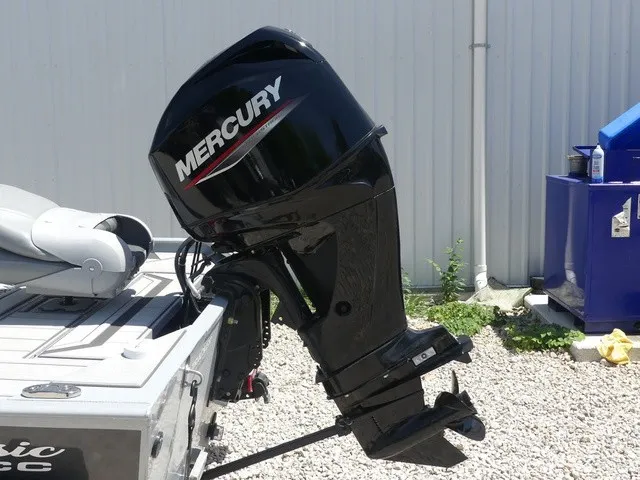 Slide: The Image of A Mercury outboard motor is attached to a boat on a gravel surface. - 15