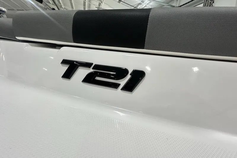 Slide: The Image of 2026 Tahoe T21 boat logo on sleek white surface. - 2