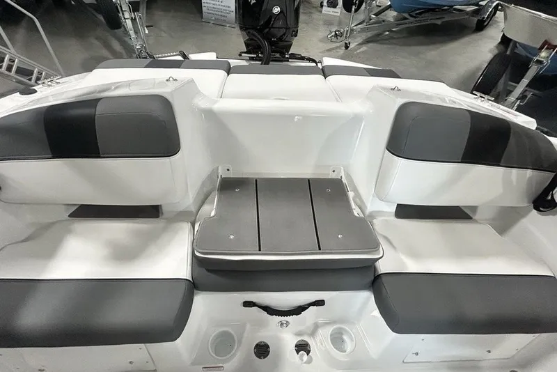 Slide: The Image of 2026 Tahoe T21 boat interior with gray and white cushioned seating. - 10