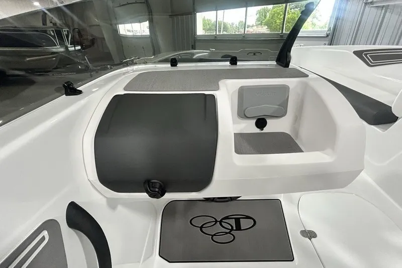 Slide: The Image of Interior of 2026 Tahoe T21 boat, featuring sleek dashboard and storage compartment. - 9