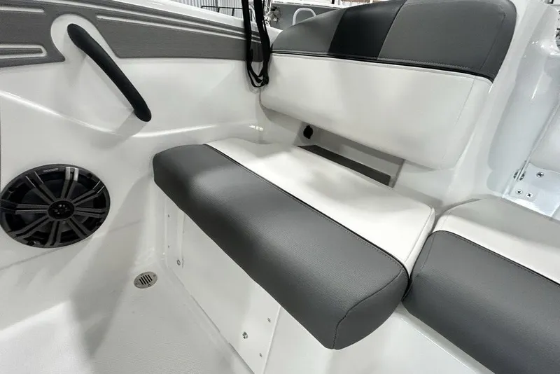 Slide: The Image of 2026 Tahoe T21 boat interior with gray and white seating and speaker system. - 8