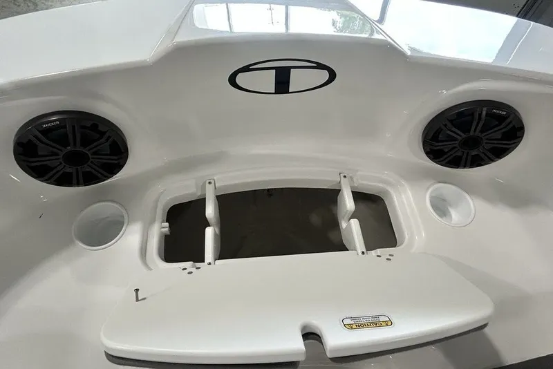 Slide: The Image of 2026 Tahoe T21 boat interior with speakers and storage compartment. - 26