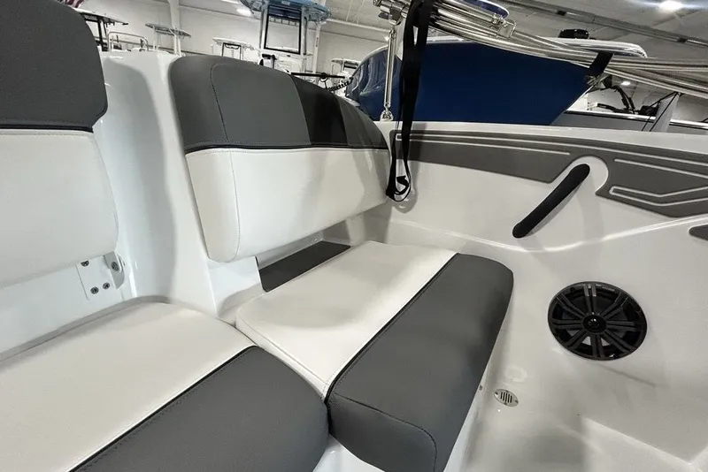Slide: The Image of 2026 Tahoe T21 boat interior with gray and white seating, speaker, and sleek design. - 18