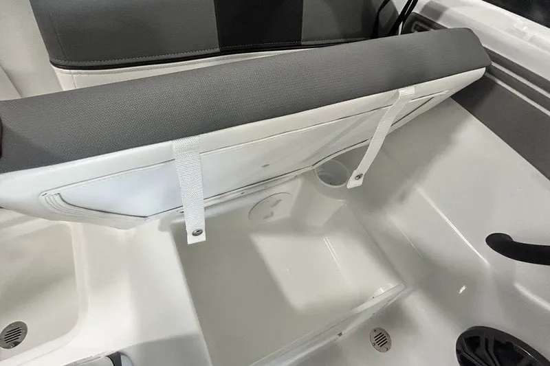 Slide: The Image of 2026 Tahoe T21 boat seat storage compartment with open lid, showcasing interior space. - 15