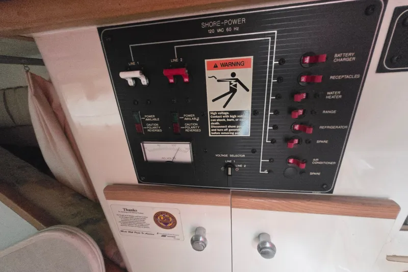Slide: The Image of Electrical panel of a 1998 Bayliner 2655 Ciera boat with warning sign. - 20