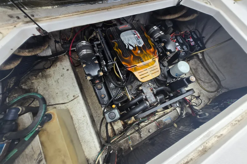 Slide: The Image of Engine compartment of a 1998 Bayliner 2655 Ciera boat, showcasing detailed mechanics. - 4
