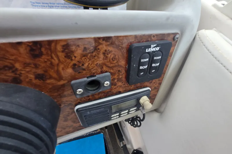 Slide: The Image of Control panel of a 1998 Bayliner 2655 Ciera boat with Lenco trim tab switches. - 14