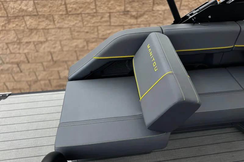 Slide: The Image of 2025 Manitou EXPLORE 24 boat seat with gray upholstery and yellow stitching. - 20