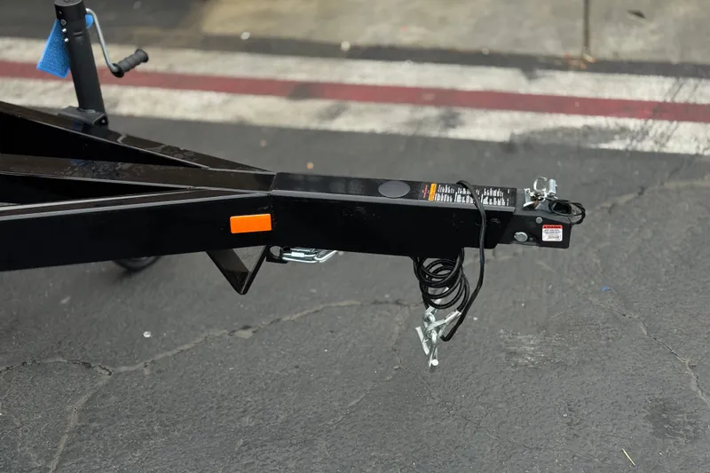Slide: The Image of Trailer hitch of a 2025 Manitou EXPLORE 24 on asphalt pavement. - 28