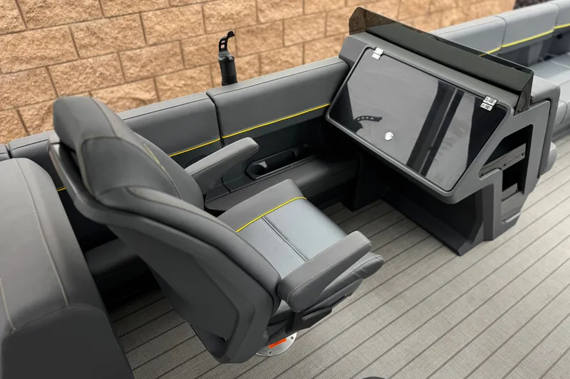 Slide: The Image of Interior of 2025 Manitou EXPLORE 24 boat with sleek seating and modern dashboard design. - 22