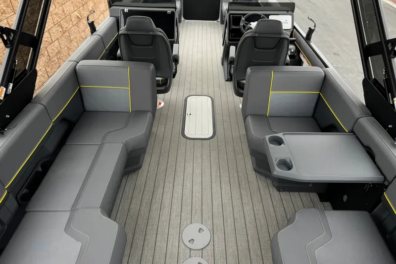 Slide: The Image of Interior of 2025 Manitou EXPLORE 24 boat with modern seating and sleek design. - 21