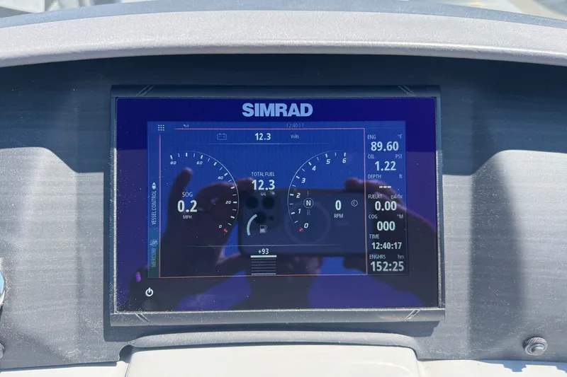Slide: The Image of Simrad display on 2023 Bennington 23 LX STERN RADIUS showing speed, fuel, and engine data. - 15