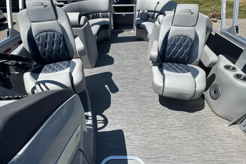 Slide: The Image of 2023 Bennington 23 LX STERN RADIUS pontoon boat interior with luxurious seating and modern design. - 11