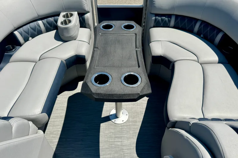 Slide: The Image of Luxurious seating area on 2023 Bennington 23 LX STERN RADIUS pontoon boat with cup holders. - 5