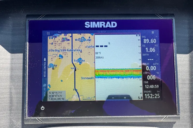 Slide: The Image of Simrad navigation display on 2023 Bennington 23 LX STERN RADIUS boat, showing map and engine data. - 17