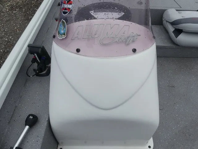 Slide: The Image of The image shows the helm of a 2018 Alumacraft 175 PROWLER boat. - 18